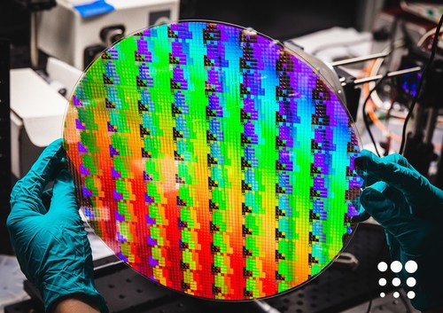 A 12-inch wafer made using standard semiconductor processes contains thousands of metasurface optics. A 12-inch wafer made using standard semiconductor processes contains thousands of metasurface optics.