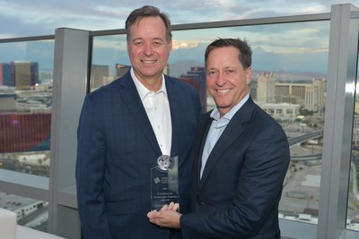 Aristocrat Leisure Limited Chief Executive Officer and Managing Director Trevor Croker (left) was presented with the newly established ESG Award for 