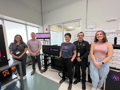 Alpenglow Biosciences and CorePlus staff stand in front of the 3Deep Imager, an imaging platform capable of bringing AI-enabled 3D imaging to pathology.