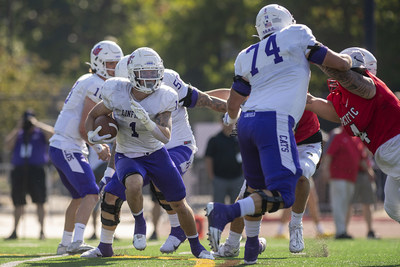 Running back Connor Morton (1) runs the ball for a gain in the first half of a game against Pacific University in Forest Grove, OR., Oct 15, 2002.