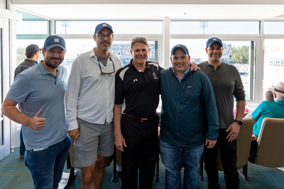 Fundamental Global and CEO Kyle Cerminara (second from right) congratulates chairman Joe Moglia (center) on induction into Coastal Carolina University's George F. "Buddy" Sasser Athletics Hall of Fame this past weekend.