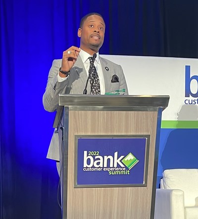 Fintech entrepreneur and Novae President & CEO, Reco McCambry addressing a crowd of bank executives after receiving the 2022 Innovator of the Year Award at Bank Customer Experience Summit.
