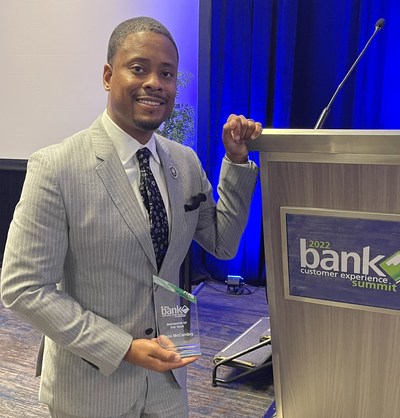 Novae's President and CEO Reco McCambry pictured holding the 2022 Innovator of the Year award presented to him at the Bank Customer Experience Summit in Chicago.