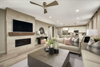 Living room with fireplace, couch, loveseat, coffee table, and ceiling fan