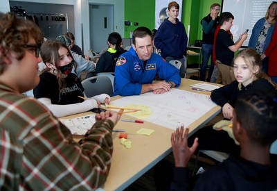 Canadian Space Agency astronaut Joshua Kutryk facilitated a Space Brain Hack session with a group of grade 7/8 students from Valley Christian School in Mission, British Columbia, assembled at the Science World science centre. Together, they explored solutions for astronauts to stay mentally healthy in space. (CNW Group/Canadian Space Agency)