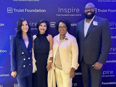 At the inaugural Truist Foundation Inspire Awards on Thursday, Oct. 20, 2022, in Charlotte, N.C., Lisa Ling, Inspire Awards host, TV personality and author (left), and Lynette Bell, president of Truist Foundation (second from right), presented Jason Hudgins, director of Strategic Programs at Atlanta Wealth Building Initiative (far right), the top award and Aarti Sahgal, founder of Synergies Work (second from left), second place and audience favorite awards.