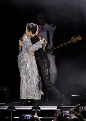 Alanis Morissette and Halsey embrace onstage at Audacy’s “We Can Survive” at the Hollywood Bowl on October 22, 2022 in Los Angeles. (Photo by Getty Images for Audacy)