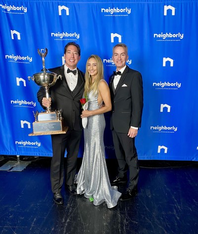 Shawn and Joni Wolfswinkel, owners of Houston's Real Property Management Preferred, celebrate being named Neighborly's Franchise of the Year with Real Property Management President Jeff Pepperney.