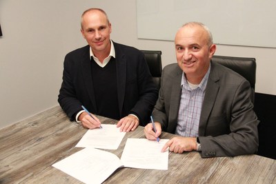 Stephan Langer (left), investment director at the Liechtenstein Group, signs an agreement with Gideon Soesman, co-founder and managing partner of Greensoil Investments, on October 17 at Greensoil's Toronto headquarters. The LGT Group is partnering with the $100 million Greensoil PropTech Ventures II fund to find, invest in and test PropTech from innovative startups in Europe and North America. With LG Group's new investment, the GSPV II fund is on track for a Q4 closing.