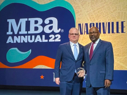 Nathan Vogt, President, First Horizon Mortgage, and Ken Crenshaw, First Horizon CRA Lending Manager, accept the award at the MBA Annual Convention & Expo in Nashville, TN