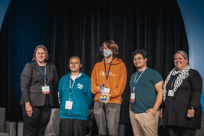 The winning team from Plymouth-Canton Community High School proudly displays their first place trophy