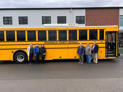 Monongalia County Schools taking delivery of a GreenPower BEAST all-electric, purpose-built school bus. In the photo are Nicole Kemper, Chief School Business Official & Treasurer, Robert DeSantis, Associate Superintendent, Donna Talerico, Deputy Superintendent, Dr. Eddie Campbell, Superintendent, Tony Harris, Director of Transportation and Mark Nestlen, GreenPower Vice President of Business Development and Strategy.