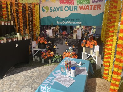 Save Our Water's booth at Hollywood Forever's Día de los Muertos celebration, showcasing a sustainable ofrenda with drought tolerant decorations.