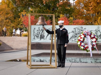 A sailor from the Naval History and Heritage Command prepares to ring a historic ship's bell at the National World War I Memorial in Washington, DC as part of the annual Bells of Peace ceremony on November 11, 2022, 11:00 a.m. EST. Bells of Peace is sponsored by the Doughboy Foundation in honor of all those who served and sacrificed in WWI, all veterans, and all active-duty military personnel.
