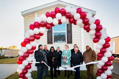 The West Branch Village expansion ribbon cutting included Rob Barr, Havenpark's Regional Vice President; Todd De Leon, Havenpark's Divisional Vice President; Lecoyia Walker, West Branch's Community Manager; Troy Hames, President of IMHA, Joanne Stevens, IMHA Board Member and former President; Bobby Kaufman, Iowa State Representative for the 73rd District, Amanda Miller, the Lake Ridge Community Manager; and Colton Miller, West Branch City Mayor Pro Tem