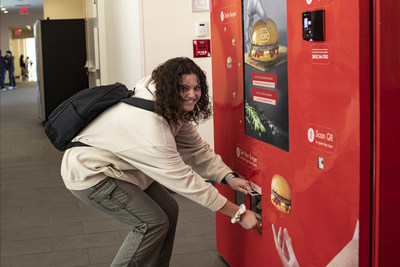 Student picking up her RoboBurger order at St. John University in Queens, New York.