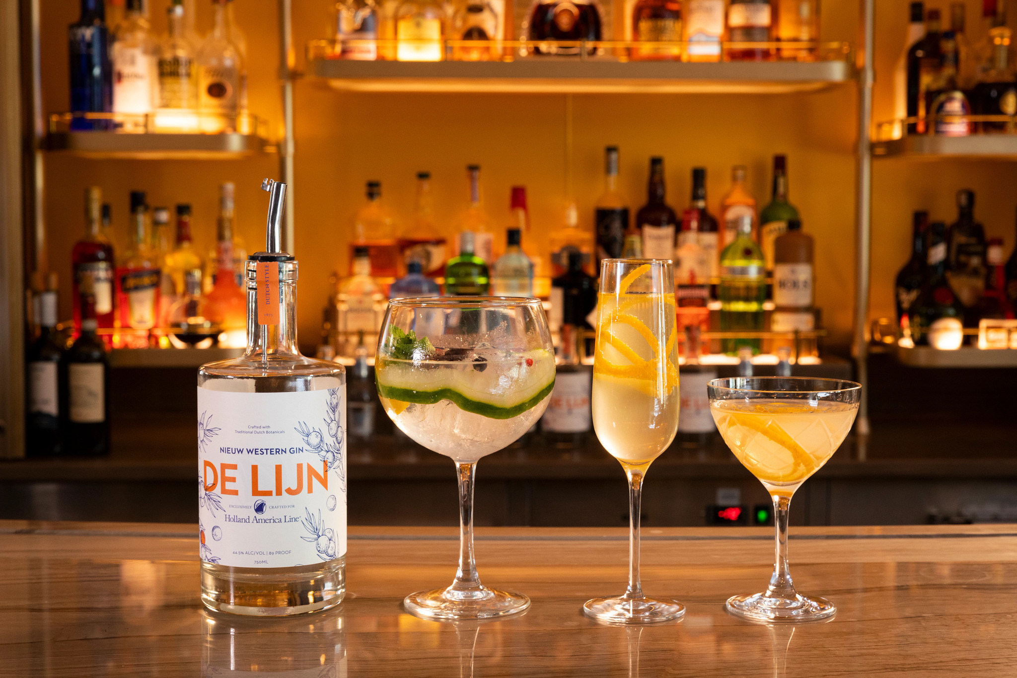 De Lijn Gin is made with a blend of Dutch inspired botanicals, including orange and rose, along with elderberry, lemon verbena, lemon, raspberry and juniper. Each botanical is cold distilled separately for distinct and consistent flavors. The result is a premium gin, made in America, inspired by the Netherlands, and specially crafted for Holland America Line  (Image at LateCruiseNews.com - November 2022)