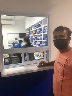 A Migrant worker awaiting his medication at the pharmacy