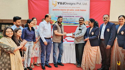 Founder and CEO of YUJ Designs Samir Chabukswar with CHRO Sachidanand Kulkarni handing over the check to the school authorities