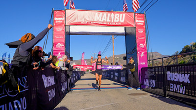 First Place Male Crossing The Malibu Half Marathon Finish Line