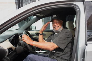 Lance Corporal Len Johnson in his new Chevy Traverse courtesy of TrueCar's DrivenToDrive initiative.