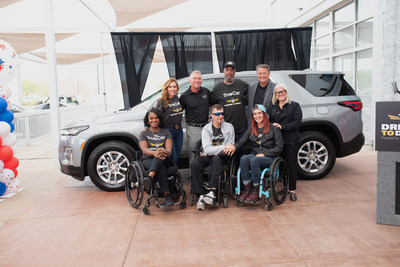 Lance Corporal Len Johnson with past DrivenToDrive recipients and the TrueCar team.