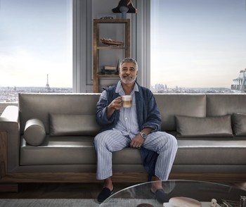 George Clooney enjoying a Nespresso coffee