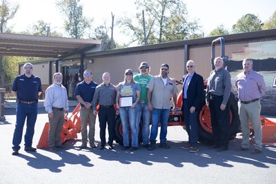 U.S. Army and U.S. Air Force veteran Robert Bartleson (green shirt) stands in front of his new Kubota MX Series utility tractor with Willie Robertson, his local Kubota dealer Coastal Machinery of Crestview, Inc., and Kubota Tractor Corporation representatives, during a special ceremony today at the Duck Commander Warehouse in West Monroe, Louisiana. Bartleson was one of five Farmer Veteran Coalition members awarded new Kubota equipment through the 2022 