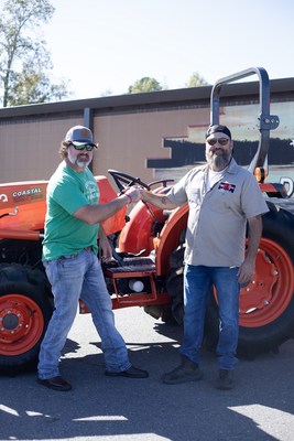 U.S. Army and U.S. Air Force veteran Robert Bartleson (left) received the keys to his new Kubota MX Series utility tractor from Willie Robertson during a special ceremony today at the Duck Commander Warehouse in West Monroe, Louisiana. Bartleson was one of five Farmer Veteran Coalition members awarded new Kubota equipment through the 2022 