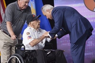Anthony Imperato shaking hands with World War II veteran Wetzel “Sundown” Sanders in 2019 after a Military Service Tribute Edition rifle presentation.