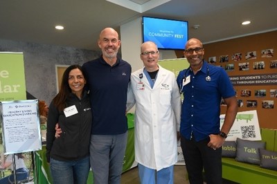 Kenya Beckman, Chief Philanthropy Officer, Providence South; Gordon McNeill, TGR Foundation President and CEO; and Providence physicians share partnership, resources during inaugural Community Fest.