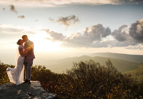 Getting married atop spectacular Bald Knob, Salt Pond Mountain’s highest peak at Mountain Lake Lodge in Pembroke, VA.  Photo Credit: Sky Ryder Photography