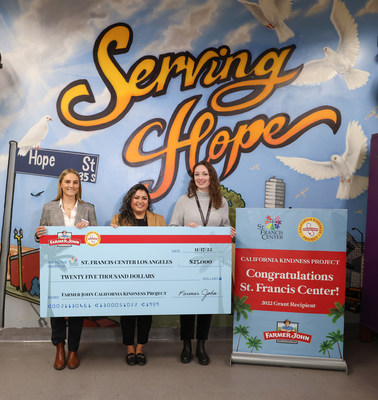 Clara Meschini, Farmer John representative, left, Jasmine Bravo, executive director, center, and Danielle Rayner, development manager, right, from St. Francis Center with a check for $25,000 which was presented to the organization as part of Farmer John’s California Kindness Project – a grant program that launched earlier this year, designed to support committed California nonprofits that are making an impact in their local communities – on Thursday, November 17, 2022 in Los Angeles, Calif.