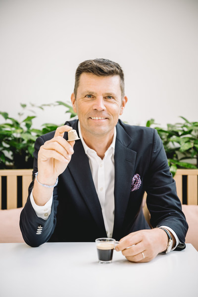 Nespresso CEO Guillaume Le Cunff with Nespresso's new paper-based home compostable capsule