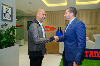 Co-Founder and Managing Director Hisham Mansour Receiving Pep Guardiola at the CFI Offices in Dubai (PRNewsfoto/CFI Dubai)