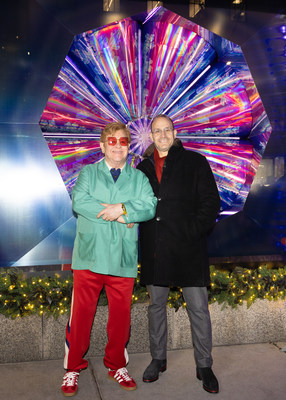 Sir Elton John and Saks CEO Marc Metrick at the Saks Holiday Show.