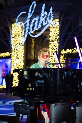 Saks unveiled its iconic holiday windows with a light show, special performance by Sir Elton John and a $1 million donation to the Elton John AIDS Foundation’s Rocket Fund Saks unveiled its iconic holiday windows with a light show, special performance by Sir Elton John and a $1 million donation to the Elton John AIDS Foundation’s Rocket Fund