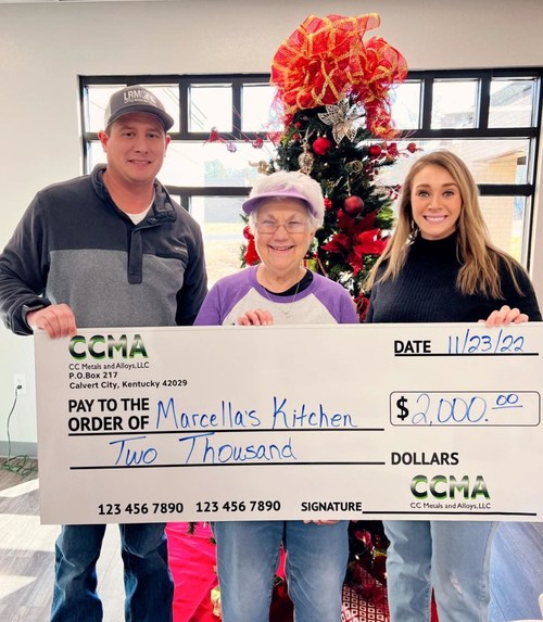 Chris Cobb and Brooke Adams of CC Metals & Alloys present a donation to Marcella's Kitchen, a non-profit community kitchen in Benton, KY, on behalf of the company.