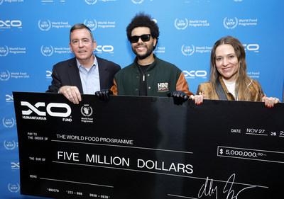 The Weeknd presents $5 million to World Food Program USA President and CEO Barron Segar, along with Sarah Dale, Binance. Photo credit: Frazer Harrison/Getty Images