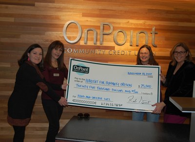 Heidi Kiani, Commercial Relationship Manager, OnPoint Community Credit Union (second from left) presents a check to Habitat for Humanity of Oregon's Sara Padilla, Grant Portfolio Director (left), Megan Parrott, Director of Engagement (second from right) and Shannon Vilhauer, Executive Director (right).