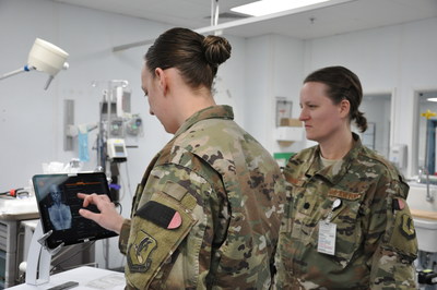 Capt. Katie Barnack, an emergency room nurse, and Lt. Col. Valerie Sams, a trauma surgeon, both currently deployed to the 455th Expeditionary Medical Group, demonstrate the T6 Health System, which is in trial phase at the Craig Joint Theater Hospital at Bagram Airfield, Afghanistan. (U.S. Air Force photo by Capt. Anna-Marie Wyant)