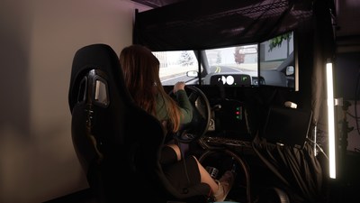 Teen driver in driving simulator navigating the simulated roadway. On dashboard, target symbol appears that they will need to search for on a visual display situated on a simulated center console. Source: CIncinnati Children's Teen driver in driving simulator navigating the simulated roadway. On dashboard, target symbol appears that they will need to search for on a visual display situated on a simulated center console. Source: CIncinnati Children's