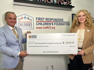 Henry Repeating Arms CEO & Founder Anthony Imperato (L) presenting a $50,000 donation to First Responders Children's Foundation President & CEO Jillian Crane (R) at the organization's headquarters in New York City.