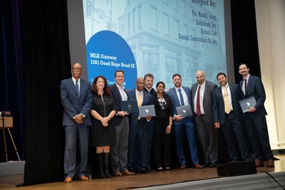 Enlightened CEO Antwanye Ford (fourth from left) pictured with the Menkiti Gorup and Consigli Construction accepting the 2022 District of Columbia Award for Excellence in Historic Preservation for Design and Construction for the MLK Gateway Project in the Anacostia neighborhood.