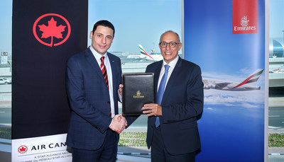 Mark Youssef Nasr, Senior Vice President, Product, Marketing, e-Commerce, Air Canada and President, Aeroplan (left) and Dr. Nejib Ben Khedher, Divisional Senior Vice President Emirates Skywards (right). (CNW Group/Air Canada)
