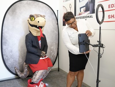 Florida Southern College's mascot, Mocsie, getting his headshot taken in the newly renovated Peter C. Golotko ’90 MBA ’96 Office of Career Services space for professional headshots.