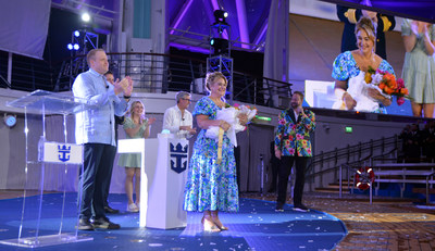 December 2022 – In a celebration fit for the world’s newest wonder, Royal Caribbean International officially welcomed Wonder of the Seas into the family in its new year-round home of Port Canaveral, Florida. Godmother and Wonder Mom from Pennsylvania Marie McCrea bestowed a blessing of safekeeping on the new ship, its crew and all who sail on it. In the one-of-a-kind AquaTheater, she was joined by Royal Caribbean Group President and CEO Jason Liberty, Royal Caribbean International President and CEO Michael Bayley, and her daughter, Allie, who nominated her for the role as part of the TikTok search launched by the cruise line. (PRNewsfoto/Royal Caribbean International)