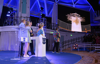 December 2022 – In a celebration fit for the world’s newest wonder, Royal Caribbean International officially welcomed Wonder of the Seas into the family in its new year-round home of Port Canaveral, Florida. Godmother and Wonder Mom from Pennsylvania Marie McCrea bestowed a blessing of safekeeping on the new ship, its crew and all who sail on it. In the one-of-a-kind AquaTheater, she was joined by Royal Caribbean Group President and CEO Jason Liberty, Royal Caribbean International President and CEO Michael Bayley, and her daughter, Allie, who nominated her for the role as part of the TikTok search launched by the cruise line. (PRNewsfoto/Royal Caribbean International)