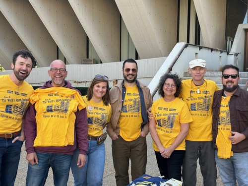 Members of Courthouse Preservation Partnership stand in front of the Will County Courthouse in Joliet, a 2022 Most Endangered site. Landmarks Illinois continues to work with local advocates to fine a reuse for the courthouse.