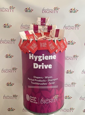 Donations for Dignity hygiene drive collection barrel filled with Aunt Flow period products.